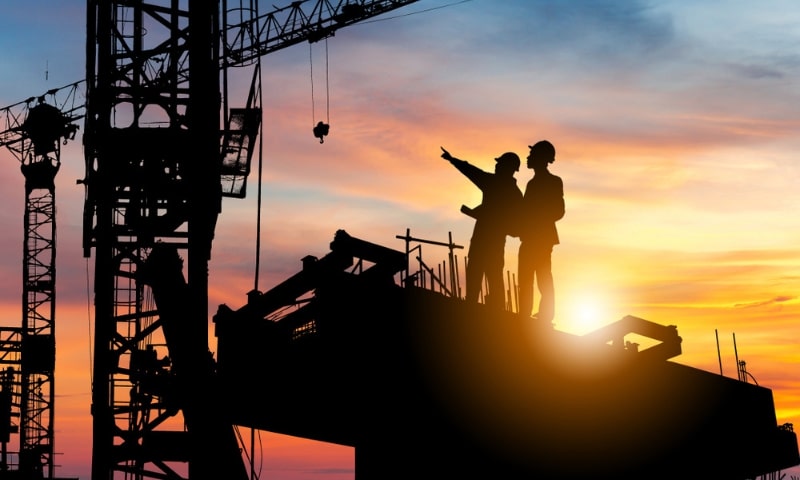 UK COC holder second engineers working on the top floor of the vessel during sunset